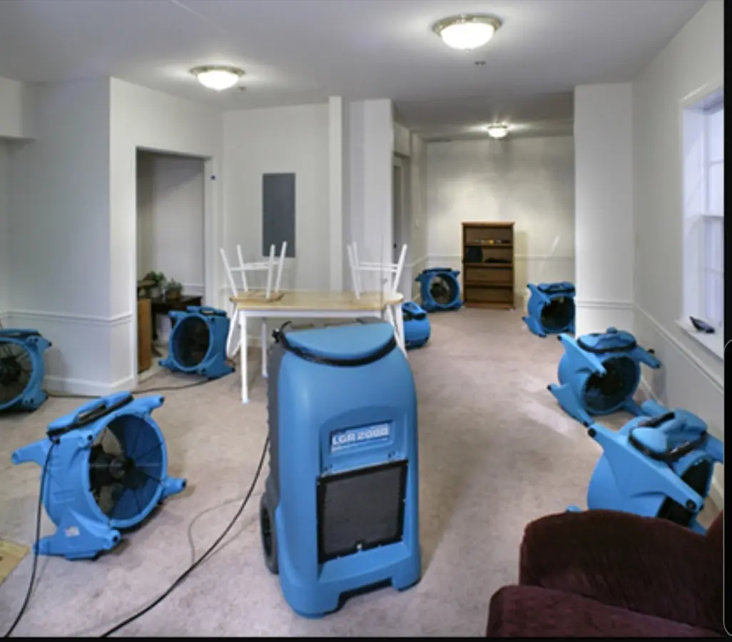 Air movers and dehumidifier setup for Water Damage Restoration in Rowley